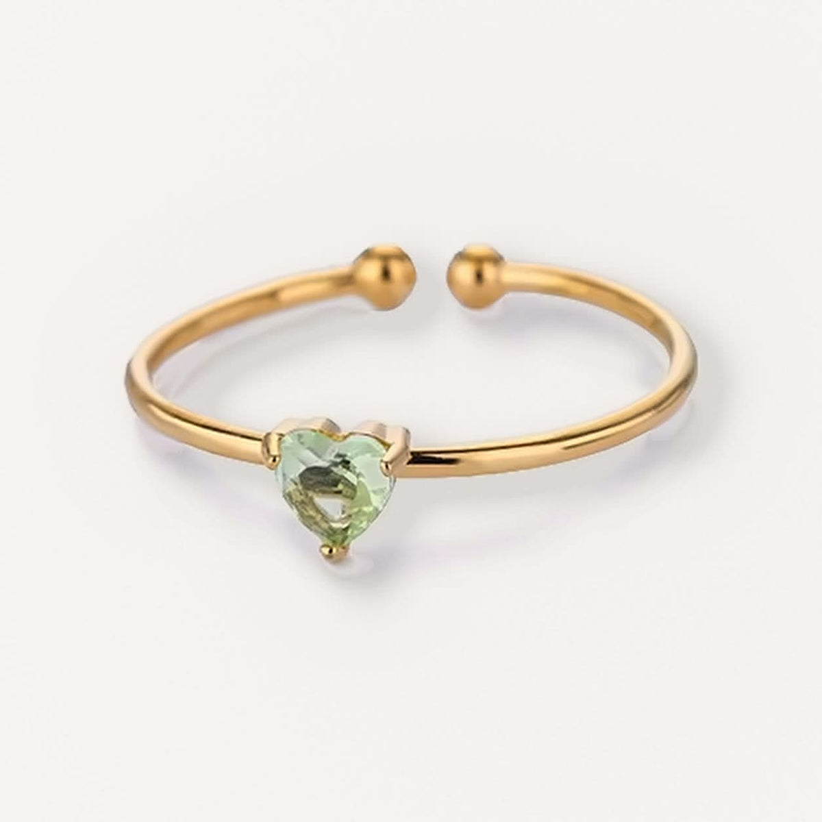 Born ring in gold with a pale green heart stone, August #Color_Gold