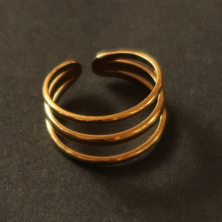 Whole ring in gold on a velvet tray