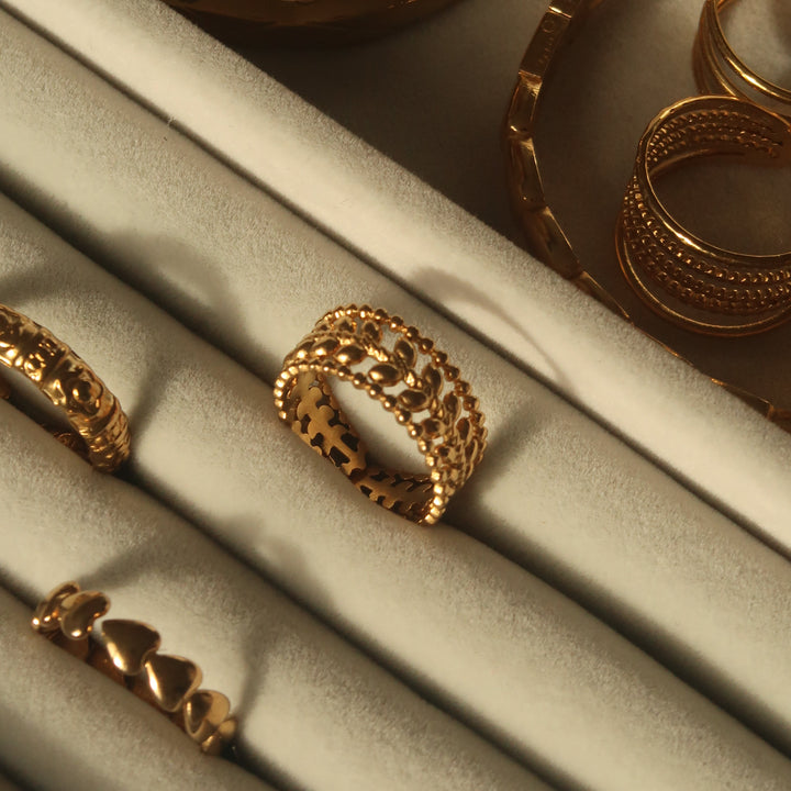Given ring in gold on a velvet tray