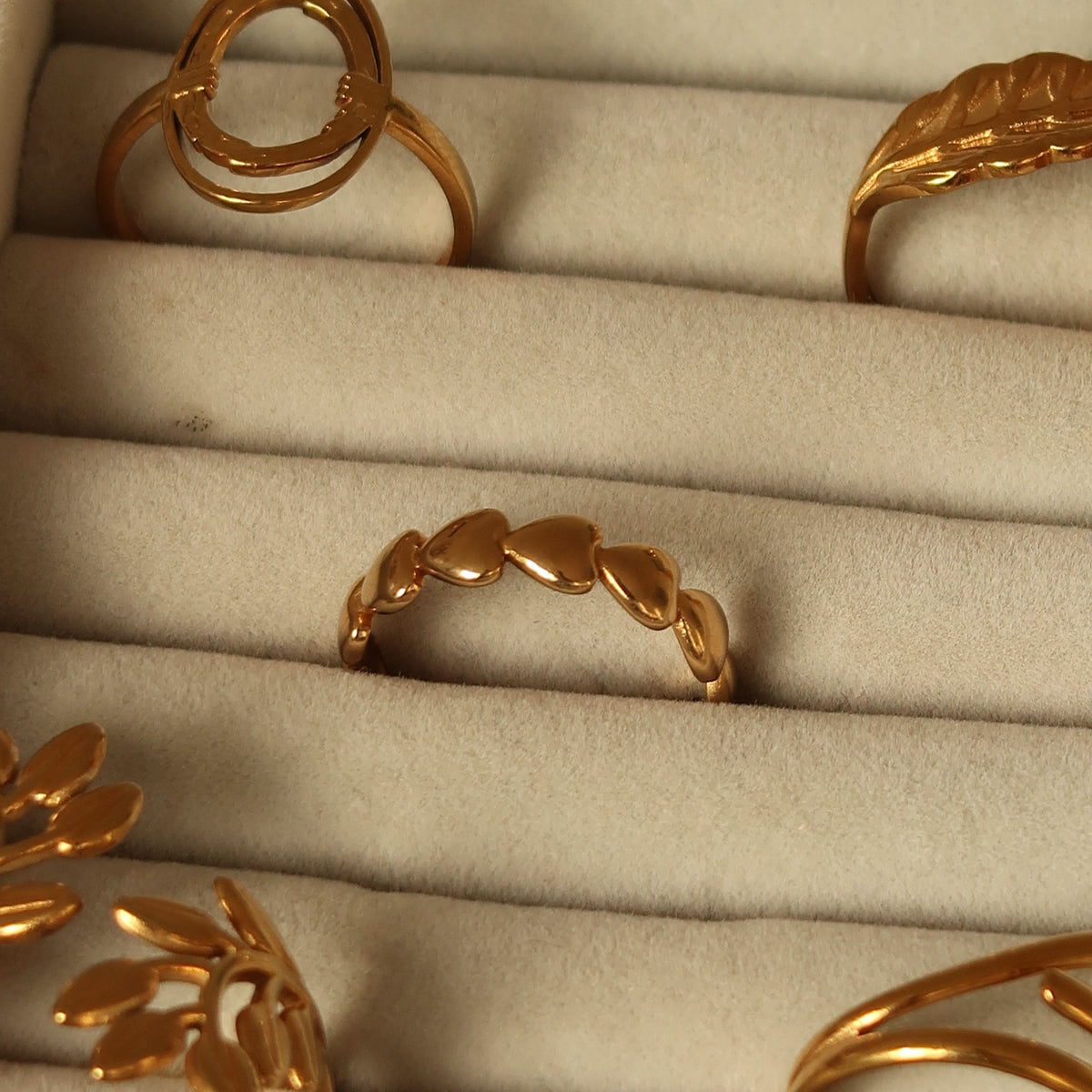 Loved ring in gold on a velvet tray #Color_Gold
