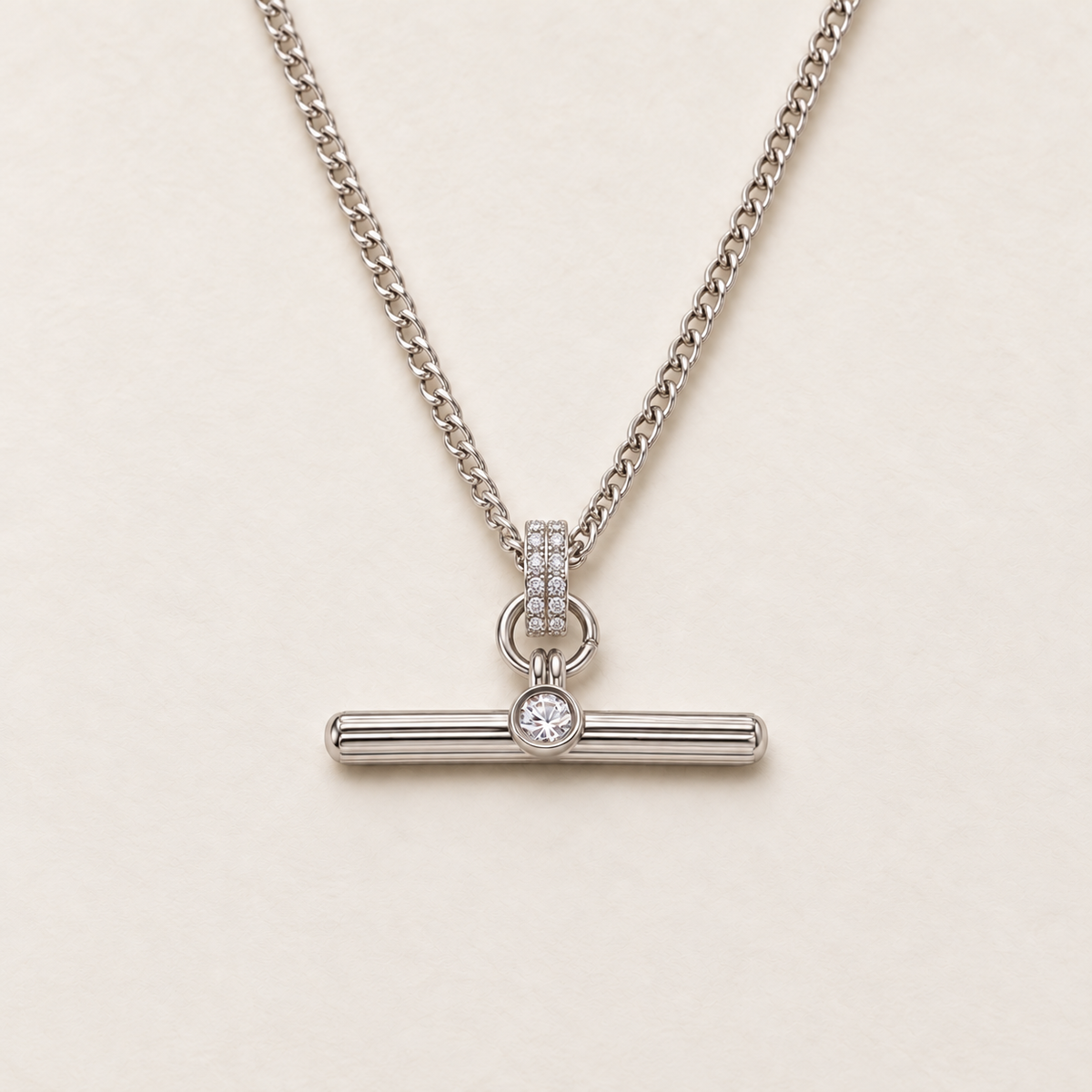 Albertina T-Bar Necklace in silver, Pavé style: fine curb chain, pavé bail with two rows of clear stones and a fluted T-bar with a single round stone