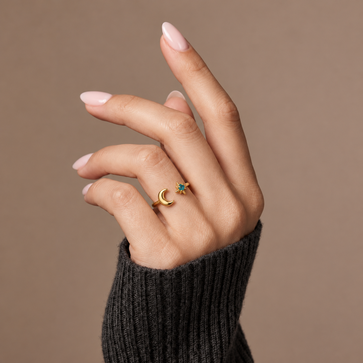 The Amora Moon & Star Ring in gold, worn on the hand #Color_Gold