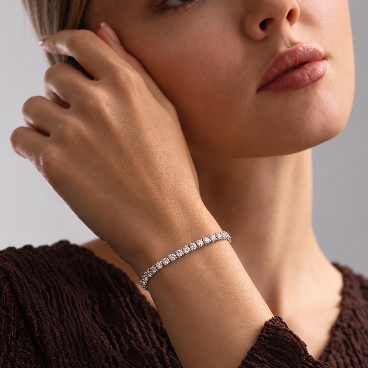 AMORA tennis bracelet worn on the wrist