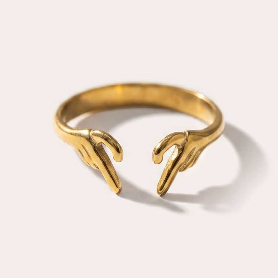 The Amora Reaching Hands Ring, gold stainless steel ring