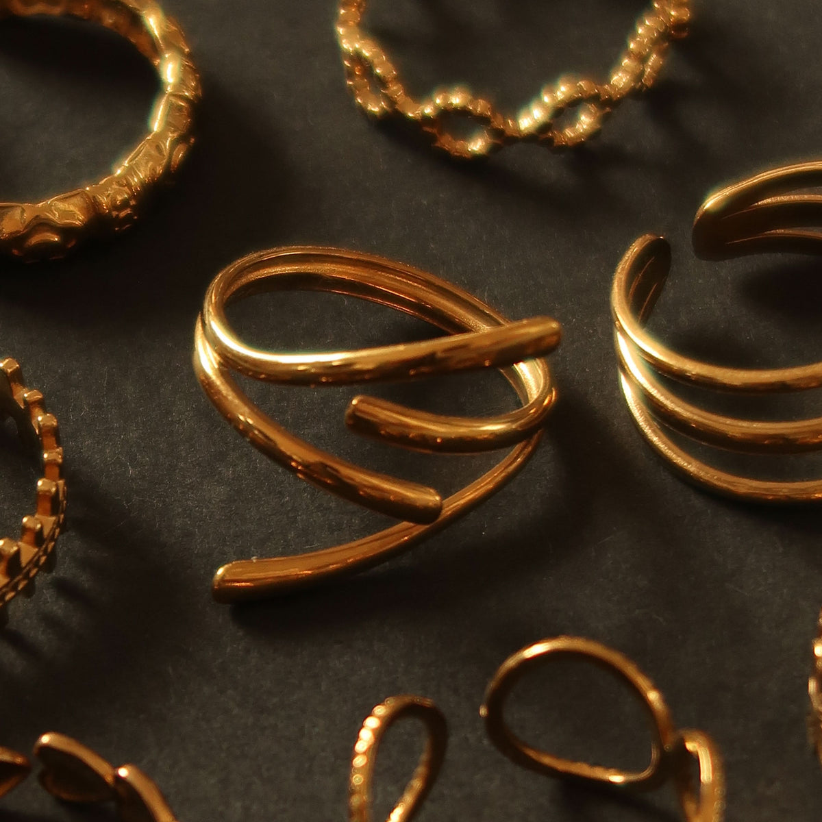 Held ring in gold on a velvet tray #Color_Gold