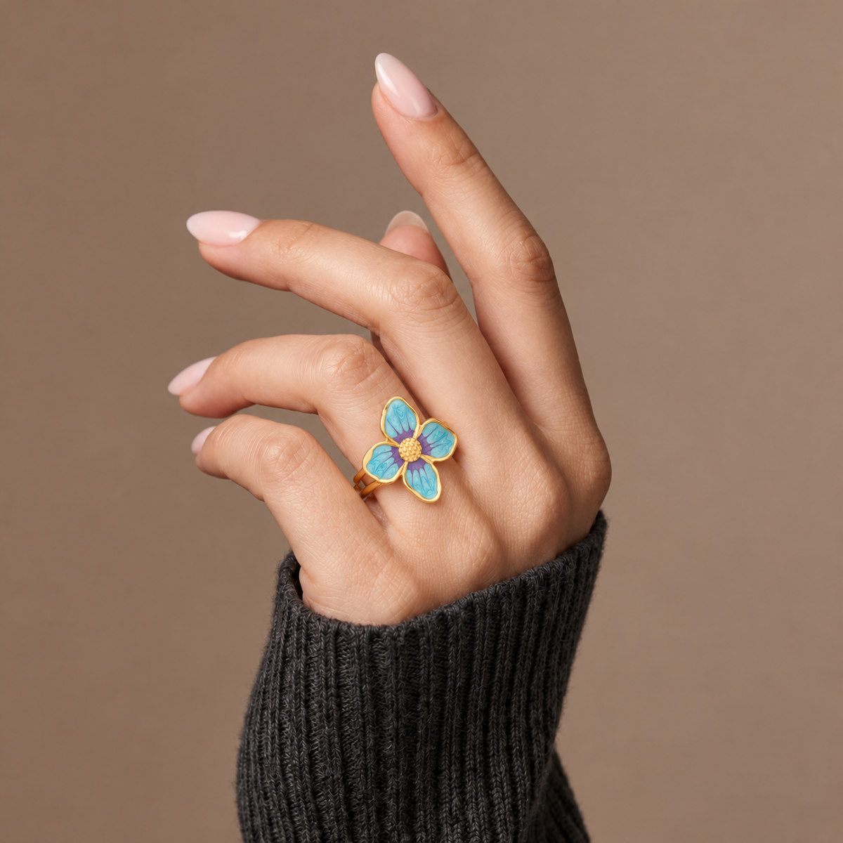 The Amora Forget-Me-Not Ring worn on the hand