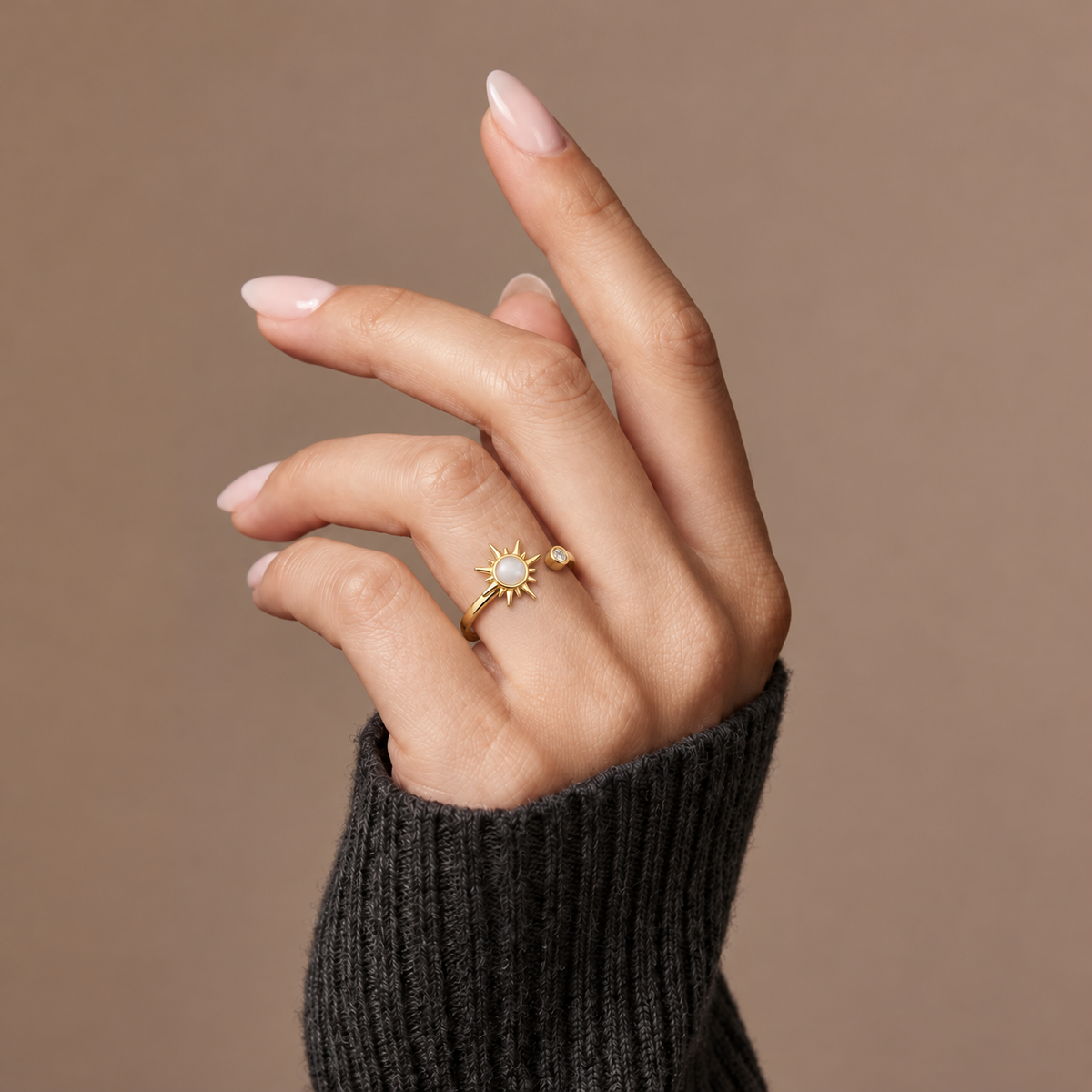 The Amora Little Sun Ring in gold, worn on the hand #Color_Gold